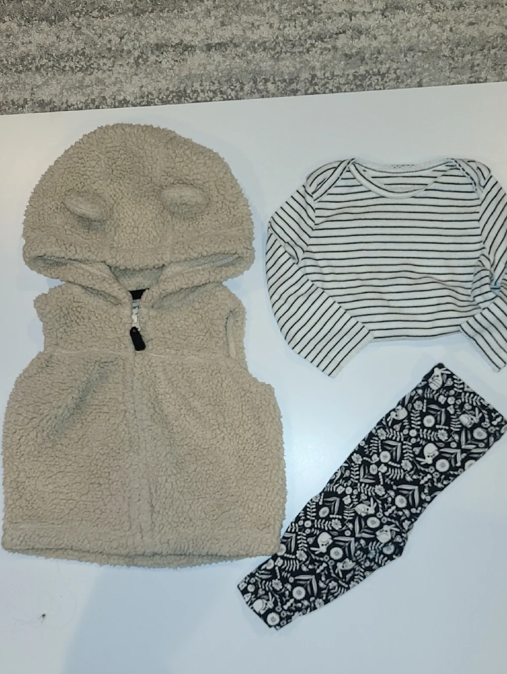 Carters Beige Sherpa Hooded Baby Vest w/ Striped Top & Patterned Leggings.